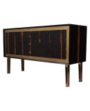 Squared linear but very elegant, due to the fact of being executed with quality materials, Macassar wood and polished brass